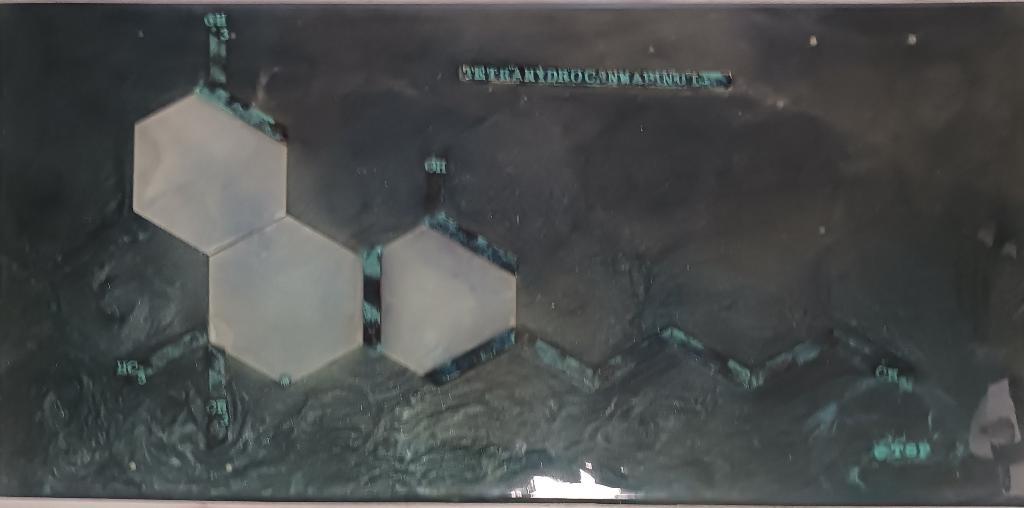 Cross Legs epoxy table featuring the tetrahydrocannabinol compound in multiple layers of epoxy providing a deep tridemtional feel