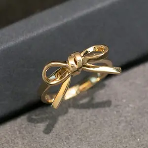 Bow-knot ring with knot design, available in multiple sizes, perfect for everyday wear as a gift for women.