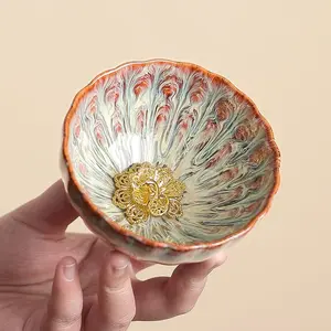 Handcrafted Jianzhan Tea Cup with Kiln-Changed Filigree Golden Lamp Glaze Color Circulation and Delicate Petal-Shaped Mouth for Tea Tasting and Gifts