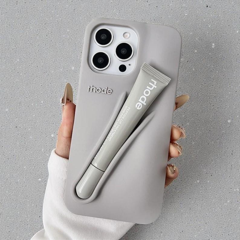 Rhode Lip Tint Silicone Phone Case with Lip Gloss Holder for iPhone 11-17 Shockproof Design Smooth Application Fashionable Protective Nutrients Convenient Daily Use