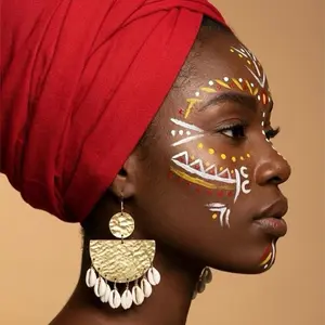 21/ CALABASH: 100% handmade natural cowries shell earrings with an accent of Gold brass material.Crafted by west Africans jewelry artisans to boldly standout and celebrate beauty  and heritage in a fashionable way.