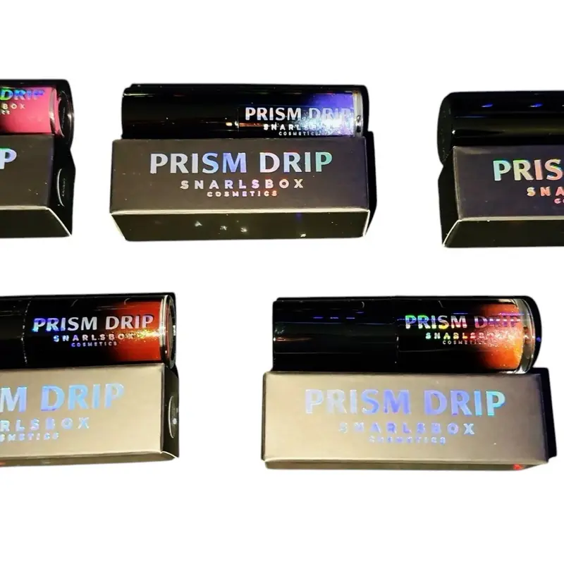 Glossy lip care lip set. Prism Drip delivers a glass-like finish packed with dazzling iridescent sparkle that shifts and catches the light with every movement.   Non-sticky formula  Ultra-sparkly multidimensional shimmer  Iridescent glow