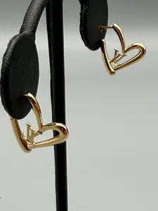 Pre-owned Louis Vuitton Limited Edition "Fall In Love" heart stud earrings in a gold tone finish featuring the iconic LV Initials logo