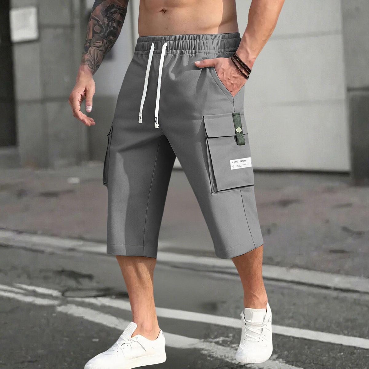 Men’s summer 2-piece cargo pants set with a drawstring waist, large pockets, and stylish letter patches—perfect for casual outings and everyday wear