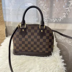 Pre-owned Louis Vuitton LV ALMA BB Damier Ebene Satchel Bag with Gold Hardware and Adjustable Strap for Everyday Use