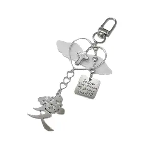Modern Crosses and Bowknot Keychain Charm Pendant for Fashion Enthusiasts