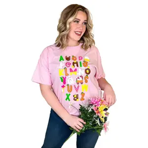 Tees2urDoor Alphabet Easter T-Shirt – Pink Cotton Graphic Tee for Teachers & Students, Easter ABC Design, Unisex Fit, Spring Classroom Wear