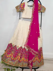 Ivory Champagne Munga Crepe Silk Lehenga with Royal Magenta Kalamkari Border & Embroidered Cutwork Dupatta