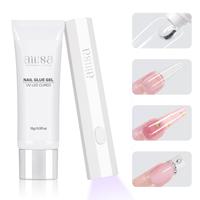 Nail glue + handheld uv lamp
