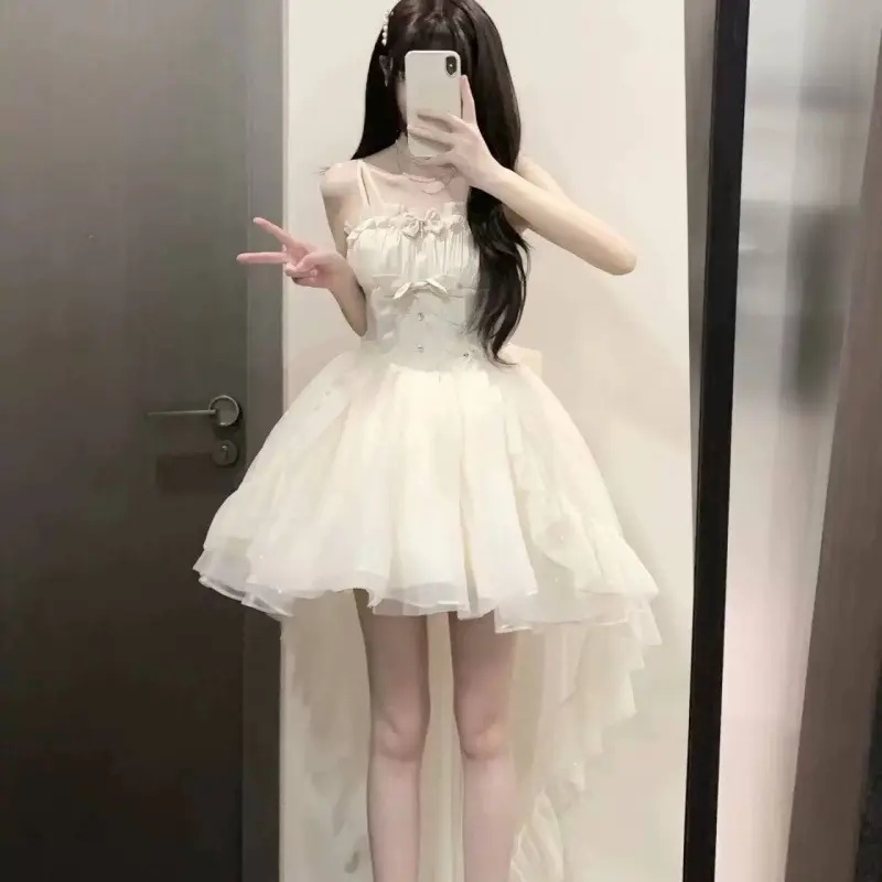 Apricot colored dress with bow and tail