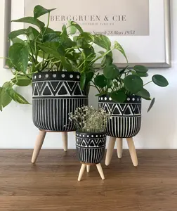 Abstract Cement Planter Pots on Tripod Wood Stands