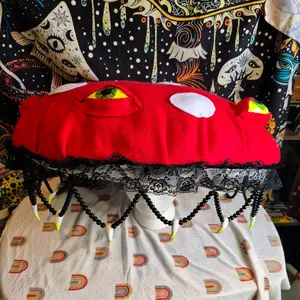 Eyeball mushroom hat. yellow glowing eyes and teeth beaded lace design. wimsical and creepy design. perfect for special events