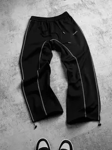 Men’s embroidered black casual athletic track pants—stylish, bold, versatile—with a drawstring elastic waistband, ankle length, stretchy, flowy, breathable, soft, lightweight, durable fabric made from polyester–spandex. Straight-leg and jogger 2‑in‑1 styl
