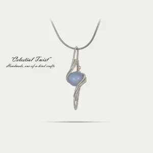 A | Celestial Twist | Handmade Wire-Wrapped Pendant | One-of-a-Kind | Cosmic-Inspired | Swirling Design | Cool Blue Accent | Everyday Wear | Date Night, Brunch, Layering, Casual Outings