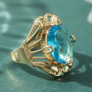 Classic 14k gold-plated ring with an oval blue synthetic zirconia stone, suitable for everyday wear, as a gift, or for parties
