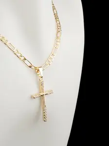 Beautiful small cross in gold plating with clear stones, includes a beautifully designed chain in 18 or 24 inches.