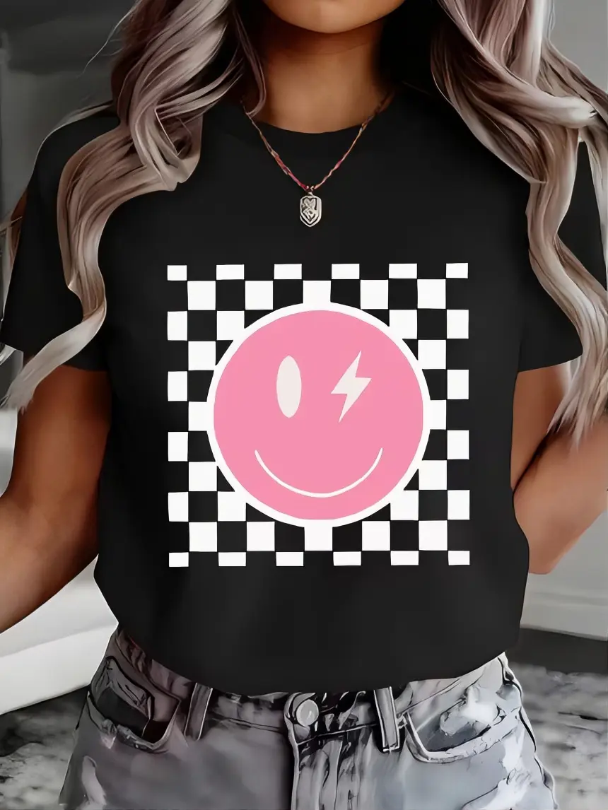 Pink Smiley Face T-Shirt with Checkered Pattern and Lightning Bolt Design for Women