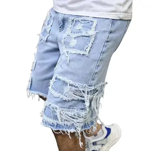 Men’s ripped denim shorts with raw hem, edgy urban streetwear style, lightweight comfortable casual bottoms, ideal for warm weather and a summer essential for everyday trendy outfits