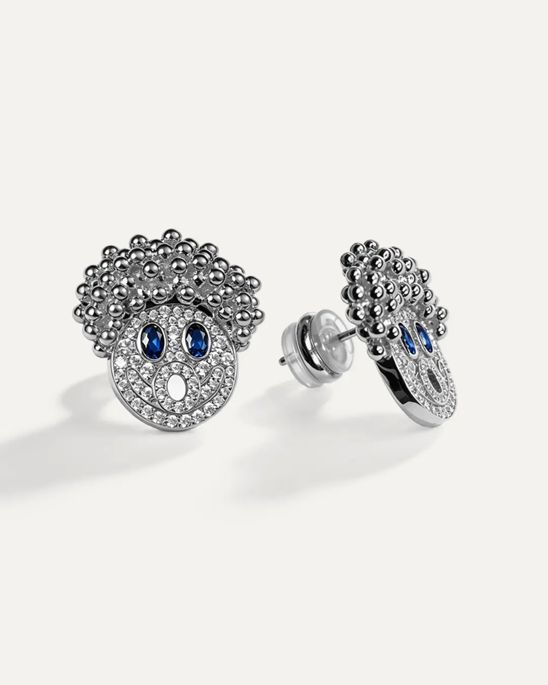 AUMPEX The Epiphany Original Iced Out Character Stud Earrings, Blue and Clear Cubic Zirconia Hip Hop Statement Jewelry for Men and Women, Gold-Tone or Silver-Tone