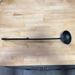 Onion holder for cleaning a grill