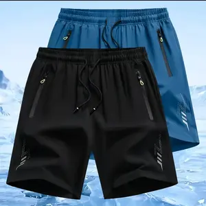 Two men’s drawstring zip shorts in a sporty casual style. Elastic waistband with fluorescent green drawstrings adds a vibrant feel, side zipper pockets enhance practicality, and a small polka dot letter print provides visual recognition. Quick dry fabric
