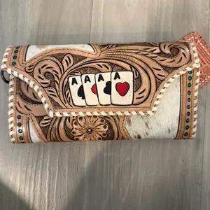 Tooled wallet with cowhide and play cards