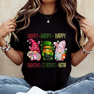 Cute Gnome Happy Valentines St Patricks Easter T-Shirt White Three Festive Gnomes Hearts Shamrocks And Bunny Ears Print For Holiday Celebrations