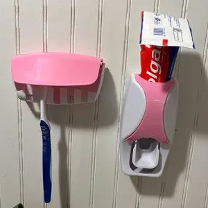 Toothpaste squeezing dispenser and toothbrush holder