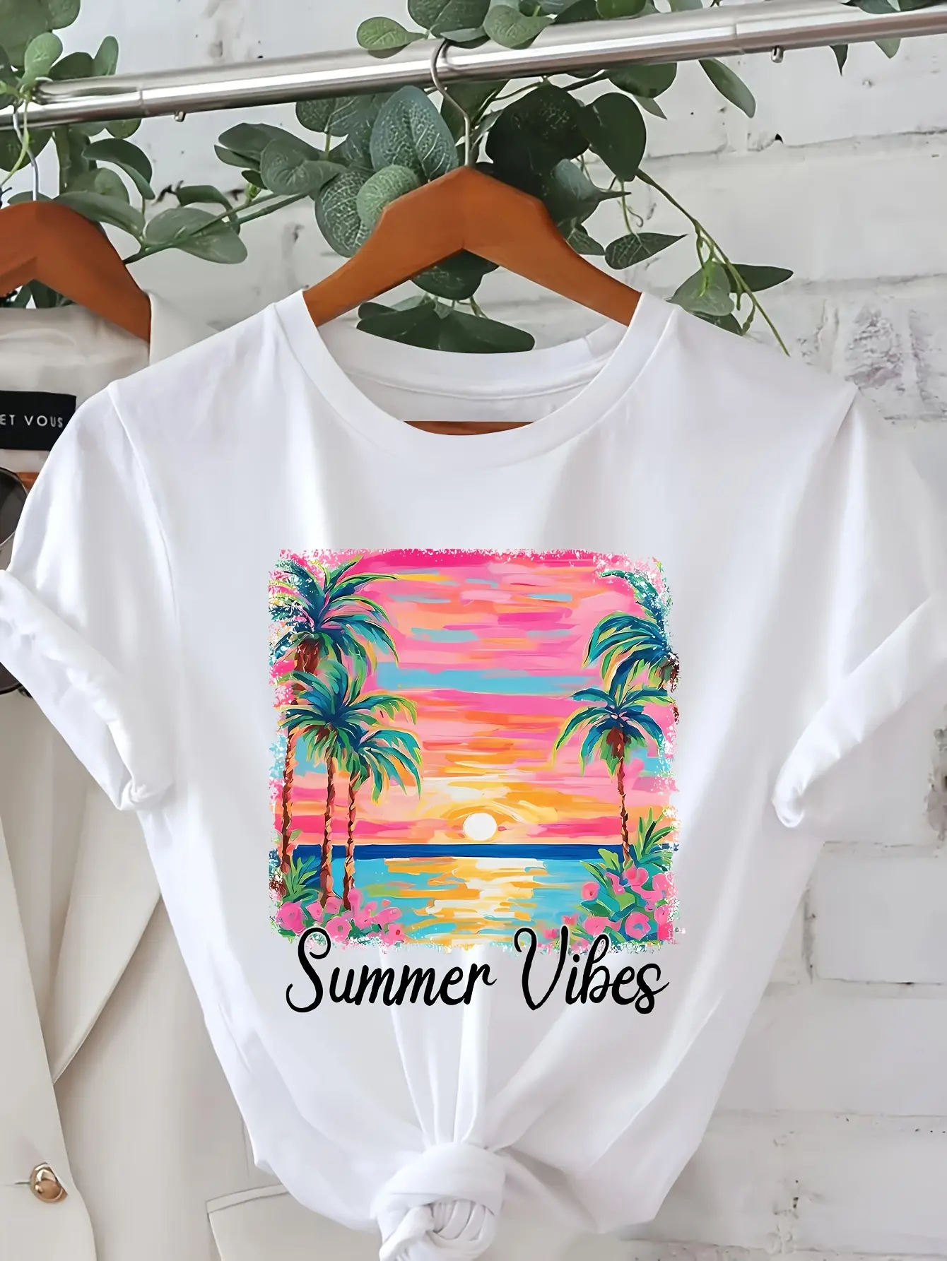 Casual Short-Sleeved T-Shirt for Women Featuring a Lively Sunset Tropical Beach Design with Palm Trees And The Phrase 'Summer Vibes' Printed on It.It Comes in a Light Beige Shade, Is Breathable, Machine Washable
