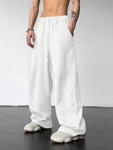 Men’s versatile solid-color drawstring loose casual athletic pants for spring and autumn, suitable for outdoor and home wear.