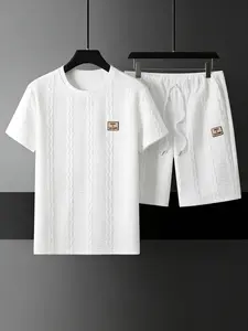 This men's sports and leisure two-piece set is suitable for daily work and outdoor activities. The short sleeved T-shirt and shorts are designed with wheat grain texture and simple fabric, showcasing personality and comfort