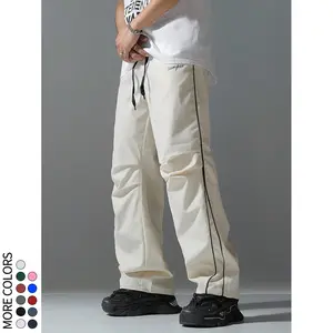 Street-style loose cargo pants with side stripe design, adjustable drawstring waist, available in multiple colors. Casual, versatile, trendy skateboard pants made from lightweight, comfortable fabric—ideal for everyday wear, commuting, and sports.
