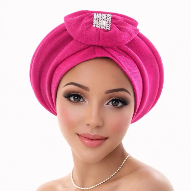 Beautiful handcrafted gele with sparkling rhinestone detail. Perfect for weddings, birthdays, and traditional events. Stylish and elegant.
