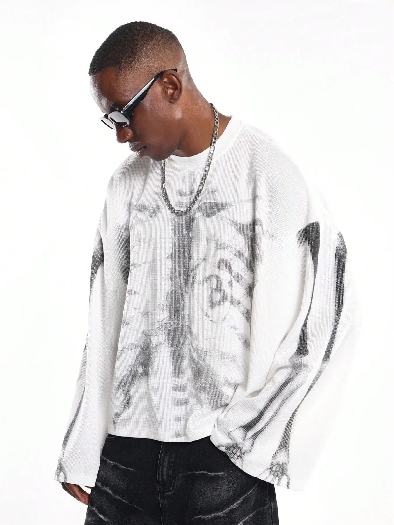 Men's white waffle-knit long-sleeve shirt, Knitwear, skeleton ribcage graphic print, oversized fit, crew neck, drop shoulders, streetwear style, edgy aesthetic, casual daily wear, urban fashion vibe, soft textured fabric, Tops