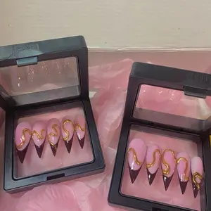 Medium Length Stiletto Nails with Gold Accents and Burgundy French Tip Design for Classy Looks