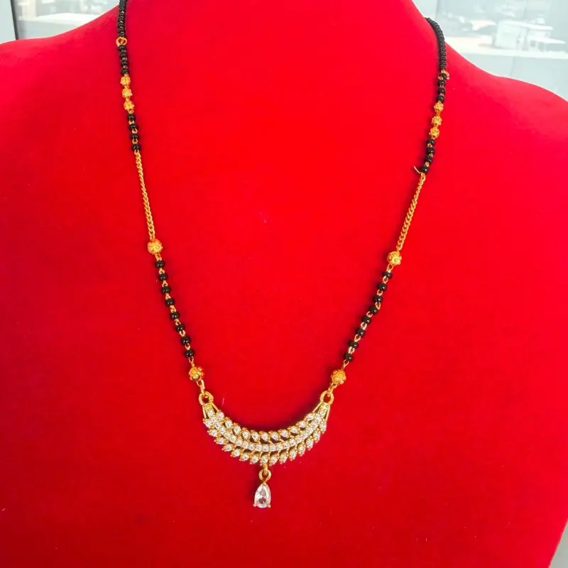 Gold plated daily use Nepali  Mangalsutra with black potey and multiple stone work on it.