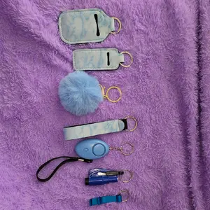 Keychain Set with Alarm, Lip Gloss Holder, Lotion Bottle, and More. Keychain Set with Alarm, Lip Gloss Holder, Lotion Bottle, and More.