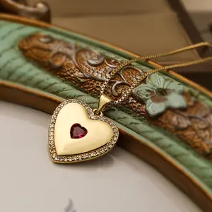 Heart shaped pendant 18k gold plated with pink gemstone center heart