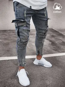 Men’s slim-fit stretch denim jeans with a distressed ripped skinny design, aged frayed hem styling, fashionable style, comfortable elastic waistband, casual wear