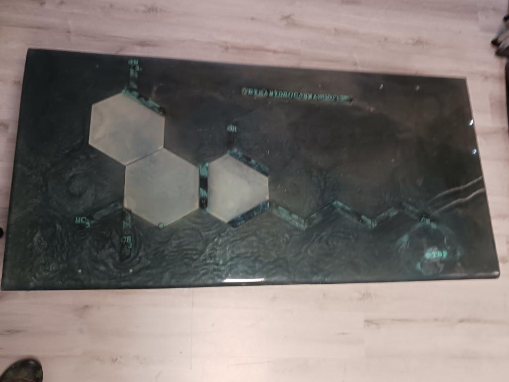 Cross Legs epoxy table featuring the tetrahydrocannabinol compound in multiple layers of epoxy providing a deep tridemtional feel