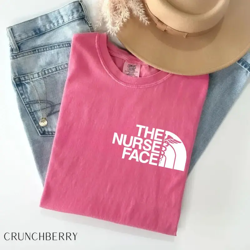 Comfort Colors The Nurse Face T-Shirt, a nurse appreciation and nurse life graphic tee, perfect for students, registered nurses, and healthcare heroes.