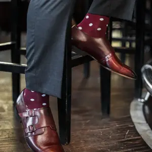 The Lazares - A Burgundy Sock with White Polka Dots