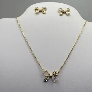 Set Oro Laminado Color 14kDiseño Moño – Collar y Aretes Elegantes