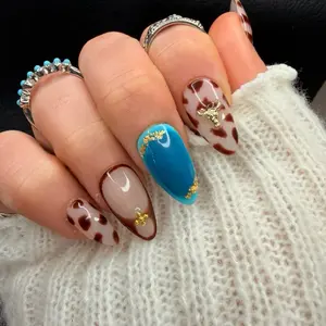 Brown Western Cow Print Press On Nails with gold Accents and Decorative Elements