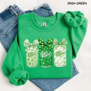 Dr Pepper St. Patrick's Day Sweatshirt/Hoodie/T-Shirt, Coquette Bow Trio Dr Pepper Cans with Green Shamrock Patterns & Bows, Irish Green Lucky Clover Soda Graphic Crewneck, Cute Festive Dr Pepper Apparel for Women and Men