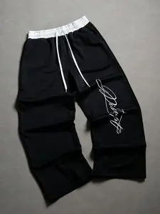 Black Wide-Leg Pants with Elastic Waist, Contrasting White Waistband, and Artistic Cursive Print