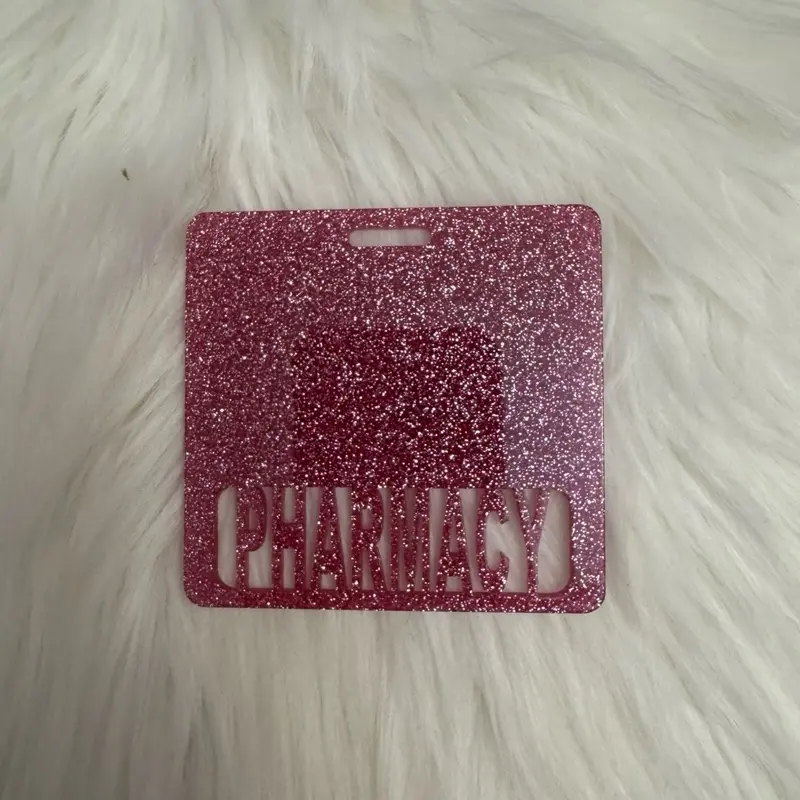 Dark pink pharmacy badge buddy