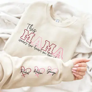 Custom This Mama Wears Her Heart On Her Sleeve Sweatshirt, Personalized Kids Name Mom Gift, Mother’s Day Crewneck
