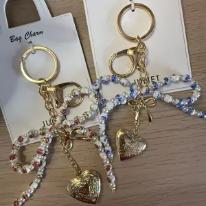 Floral pearly bow purse charm