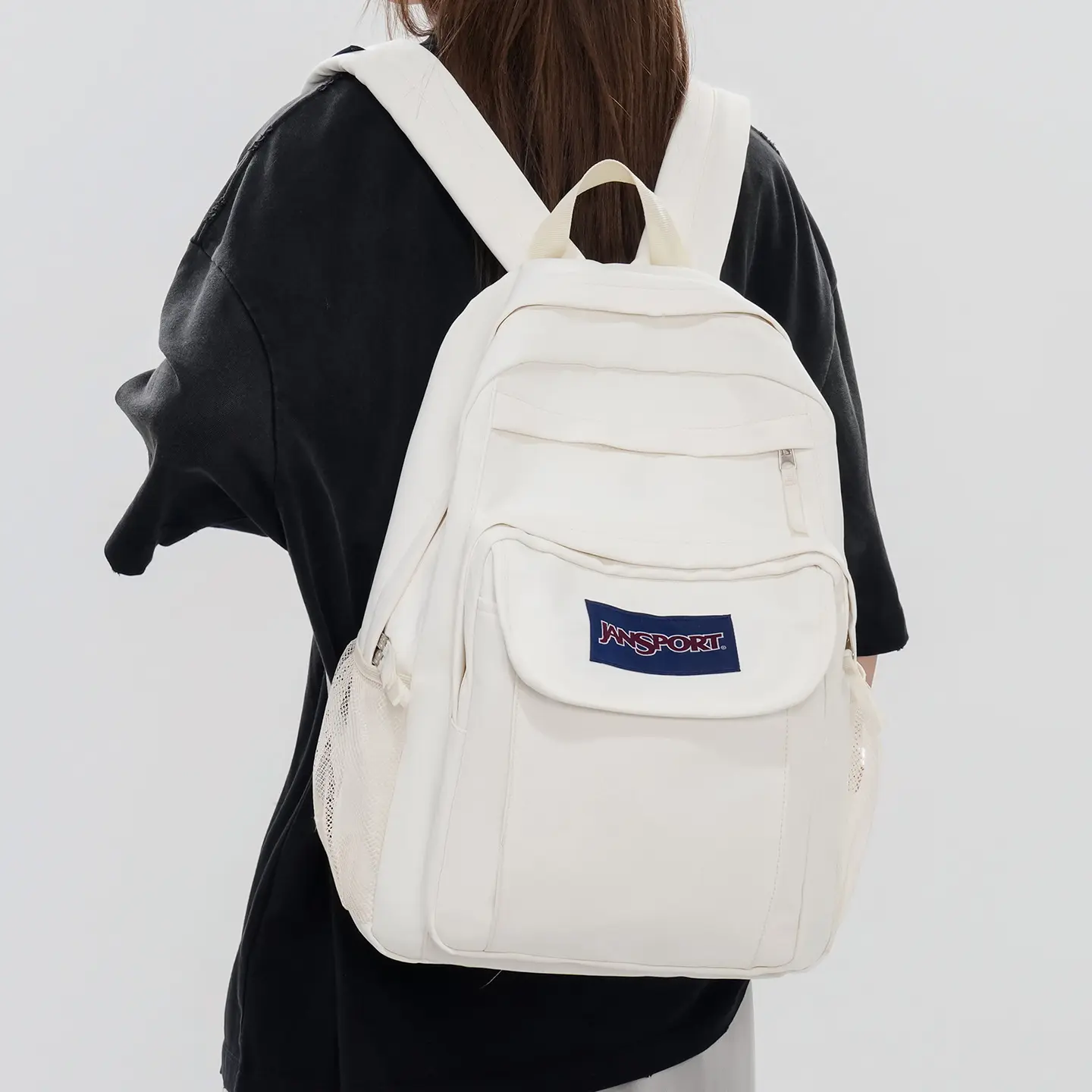 JanSport off-white multi-pocket large-capacity lightweight water-resistant laptop backpack, equipped with thickened adjustable shoulder straps and side water bottle pockets, suitable for middle school and high school students, college students’ studies, d